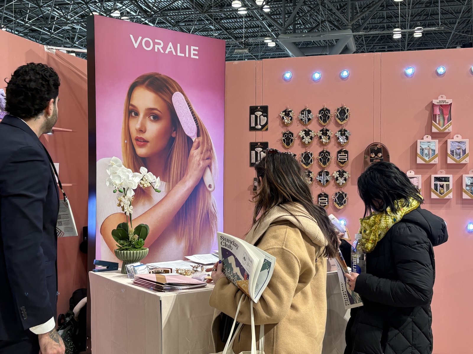 Buyers browsing VORALIE products with banner at NY NOW 2026
