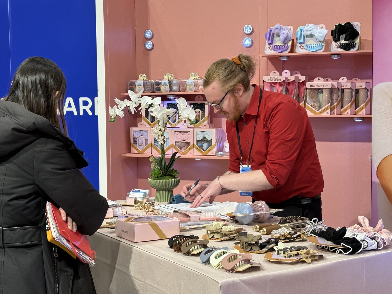 Sam writing order with buyer at VORALIE booth, NY NOW 2026